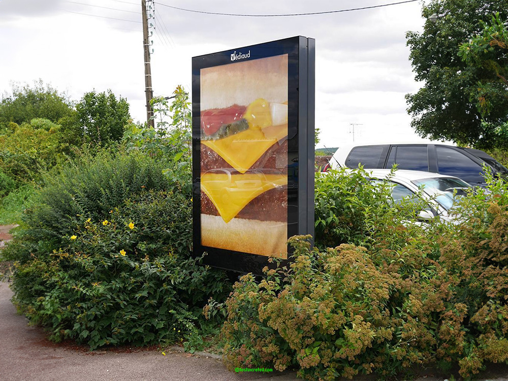 Advertising poster for McDonald's, La FertÃ©-Bernard, France