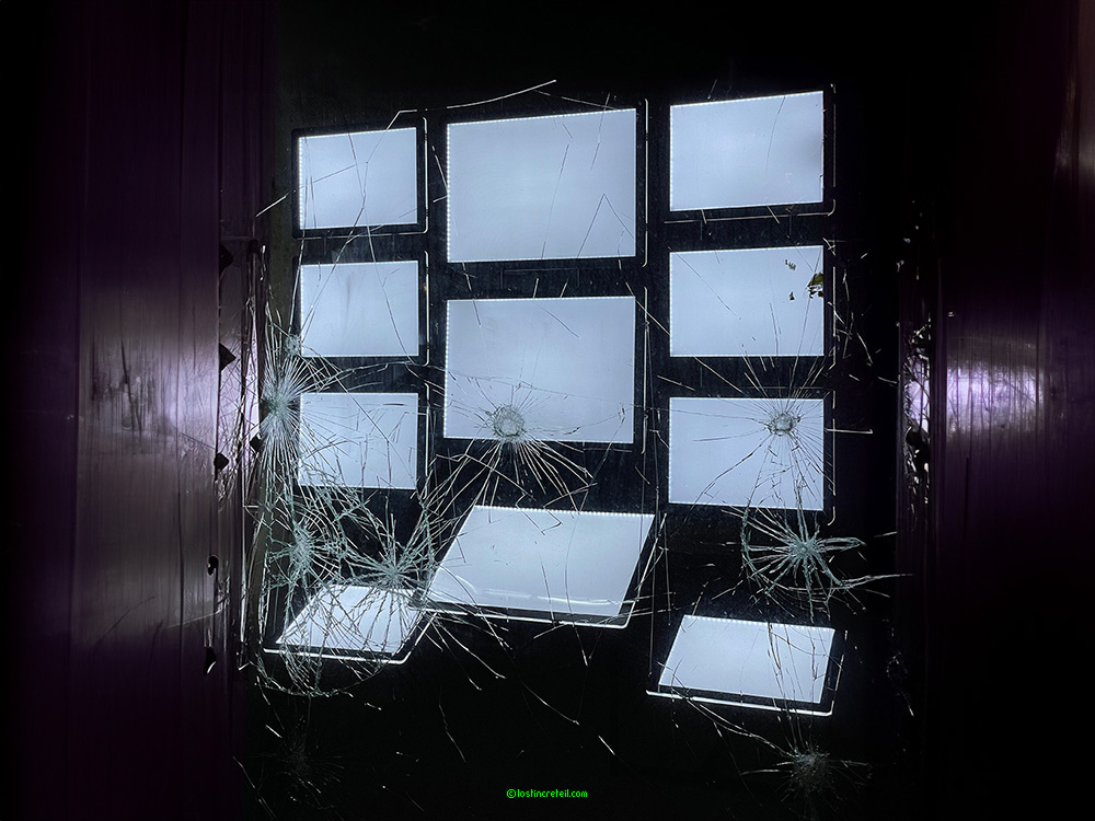 Broken window of empty real estate ads