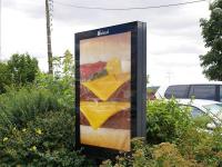 Advertising poster for McDonald's, La FertÃ©-Bernard, France